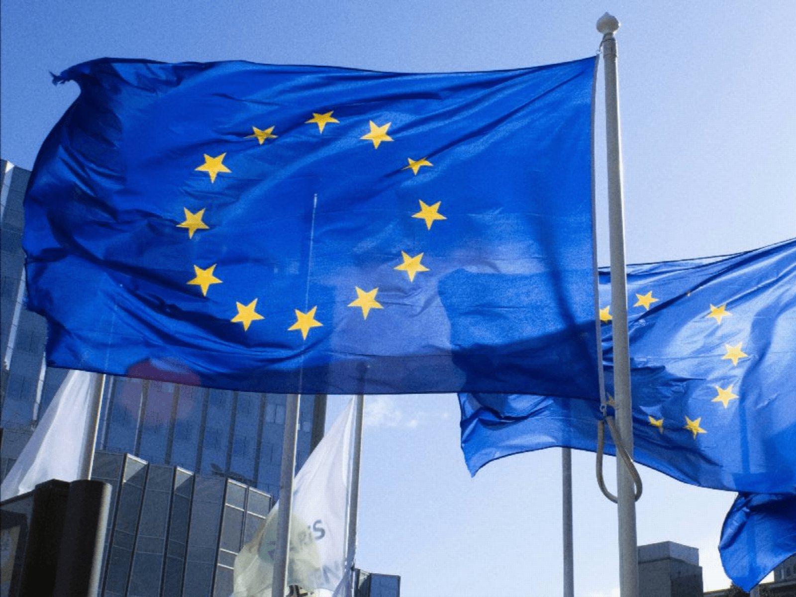 EU flag with digital music waveform and AI label icons